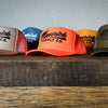 Black on Neon Orange Trucker Hat